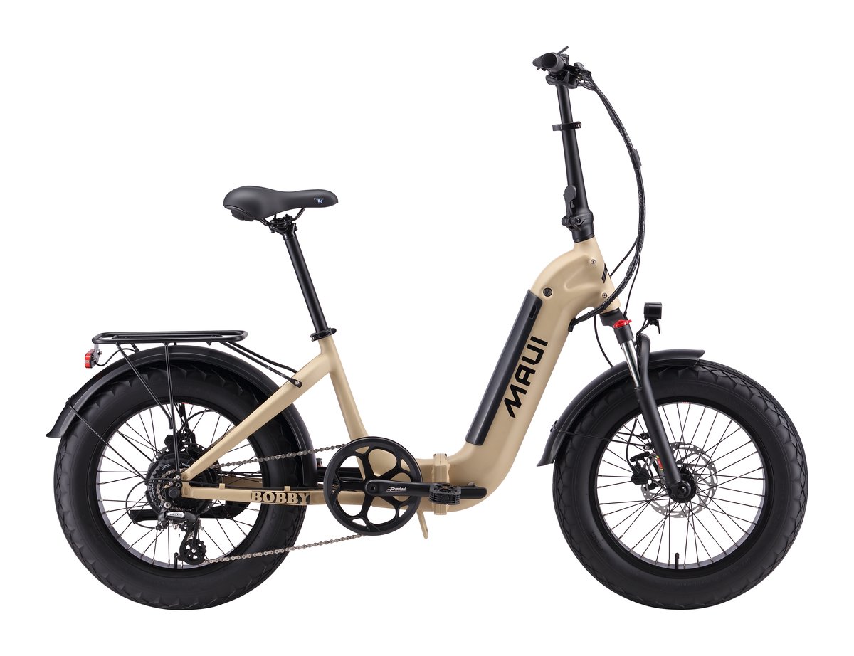 Maui Bobby compact step-thru e-bike in sand with fat tires.